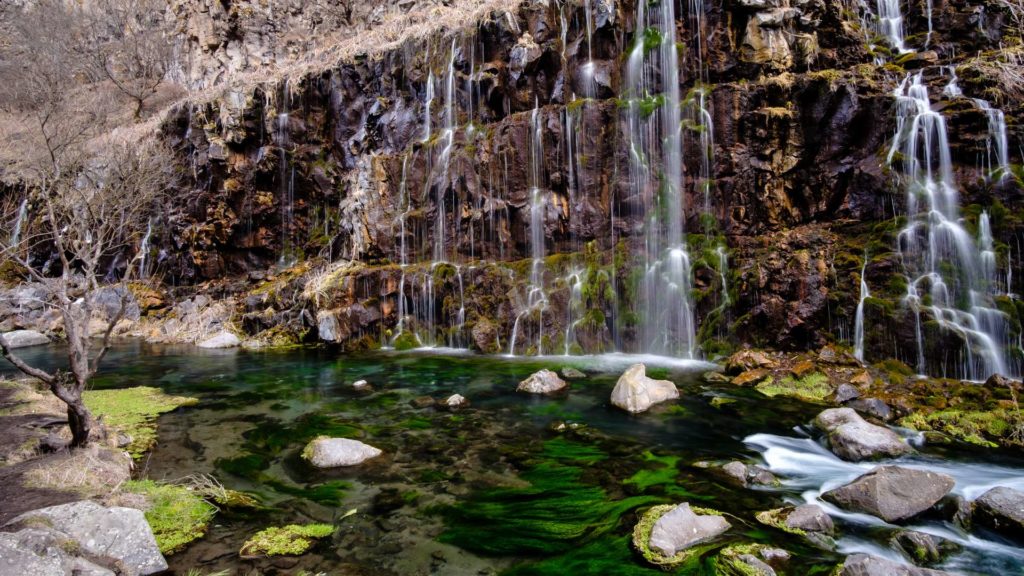 Dashbashi waterfalls with green mossy water