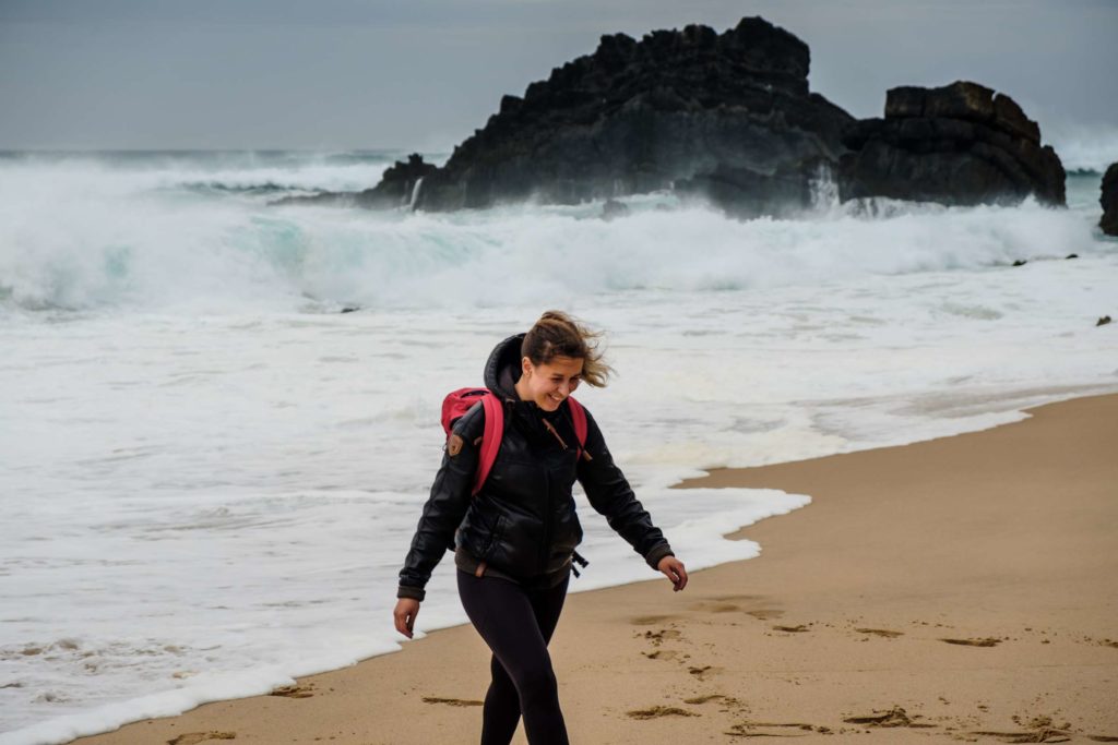 Caroline frolicking at Praia da Adraga beach