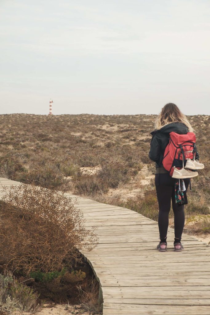 Caroline walking on boardwalk at Ilha Deserta (Deserted Island)