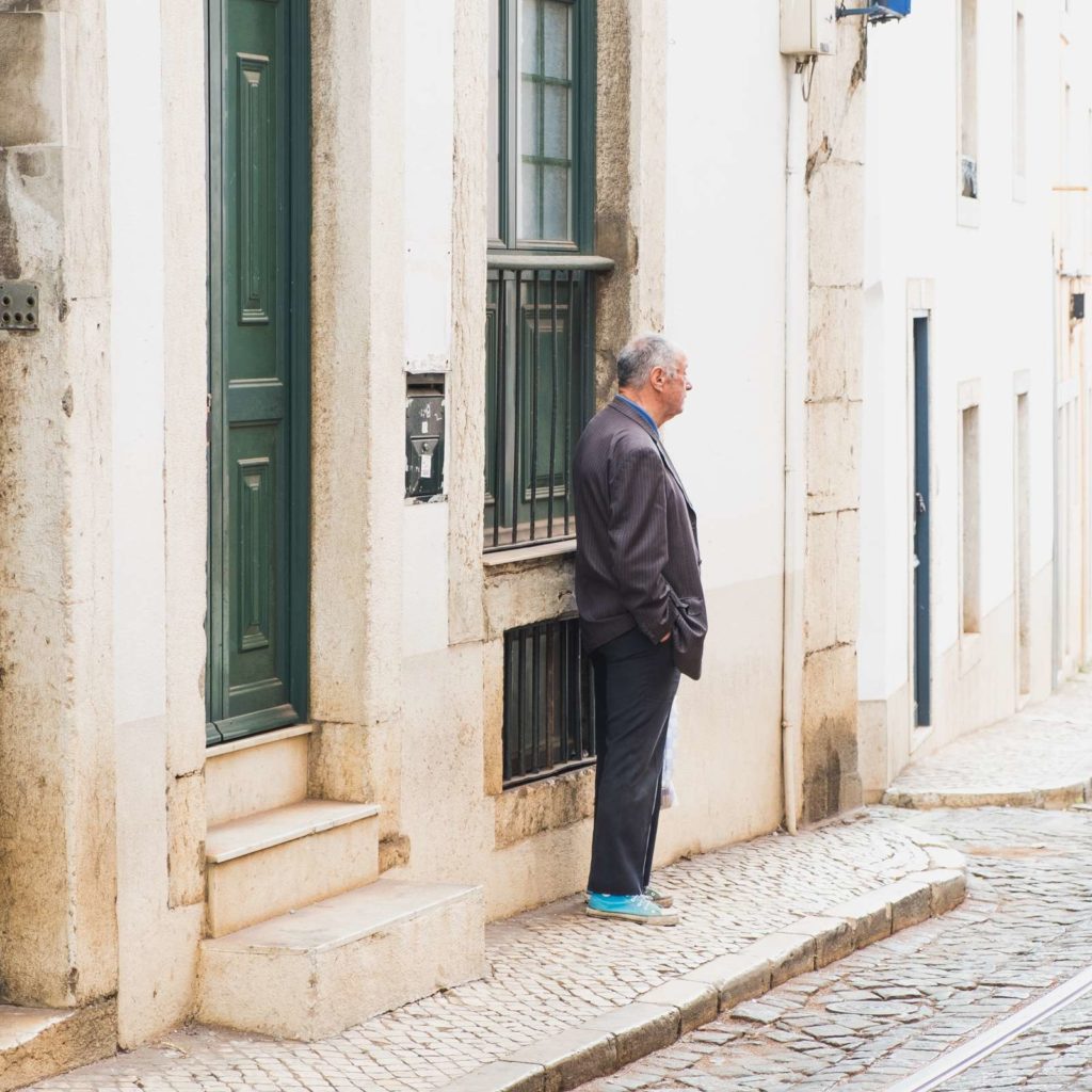 Cool old man wearing suit and teal converse