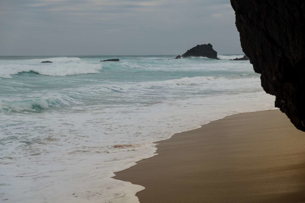 Praia da Adraga beach on a moody day