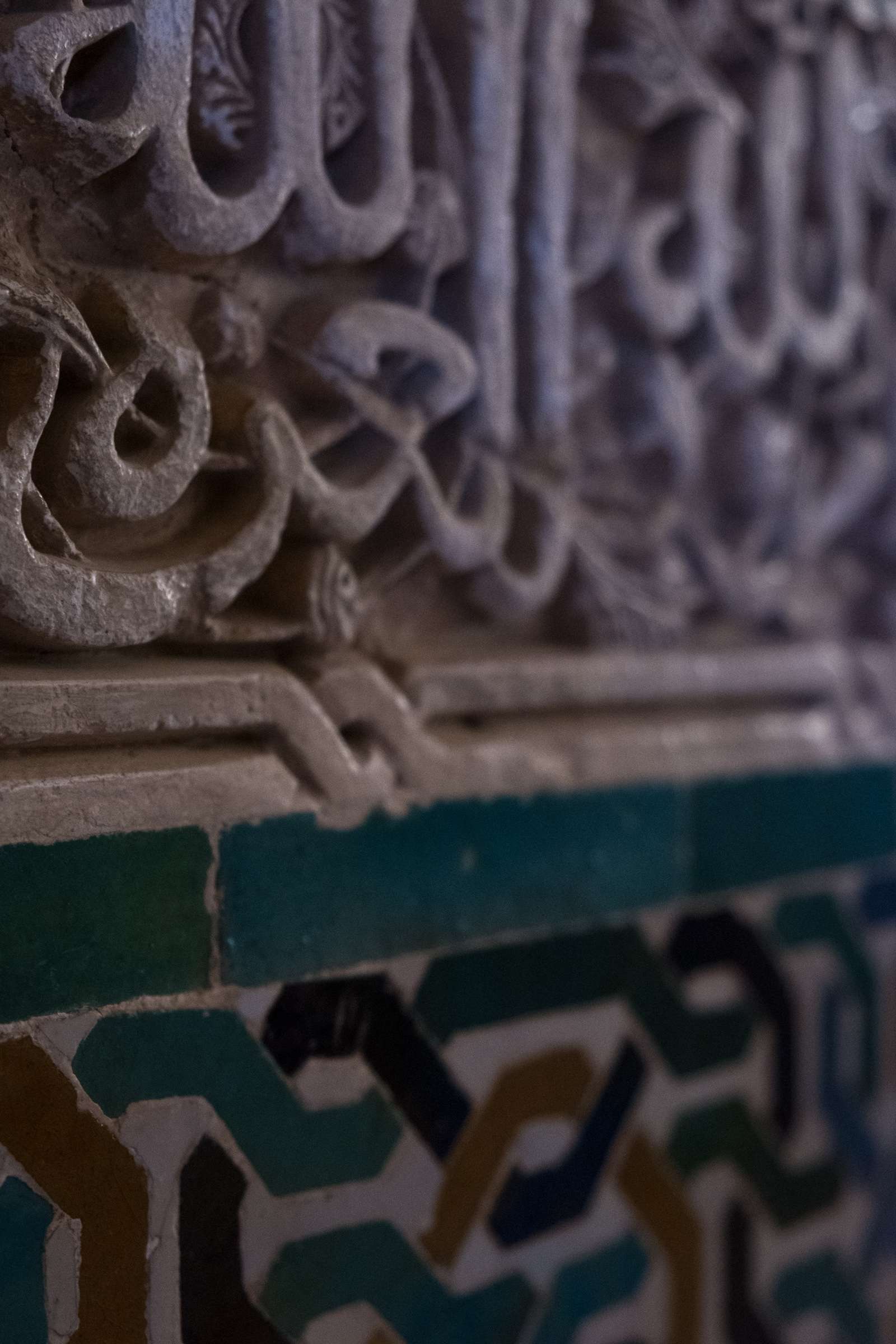 Carved Arabic letters in Nasrid Palace, The Alhambra, Granada