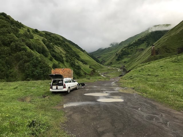 Car on the side of the road on the way out from Shatili, next to Lebiskari tower