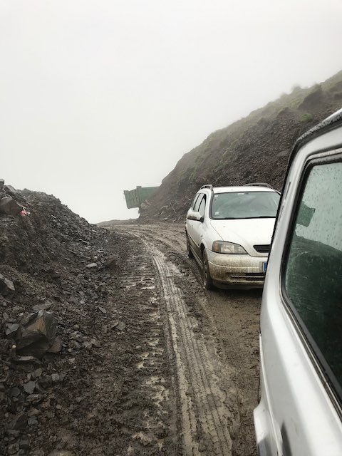 Our car stuck in the mud on Datvisjvari pass, waiting to be pulled out