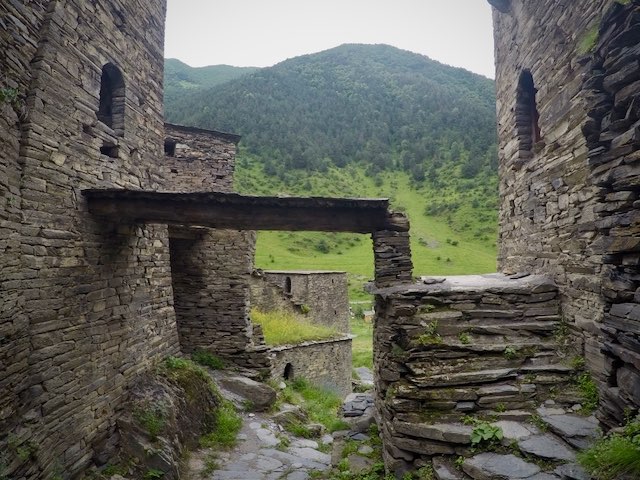 Medieval streets of Shatili with a view on the mountains