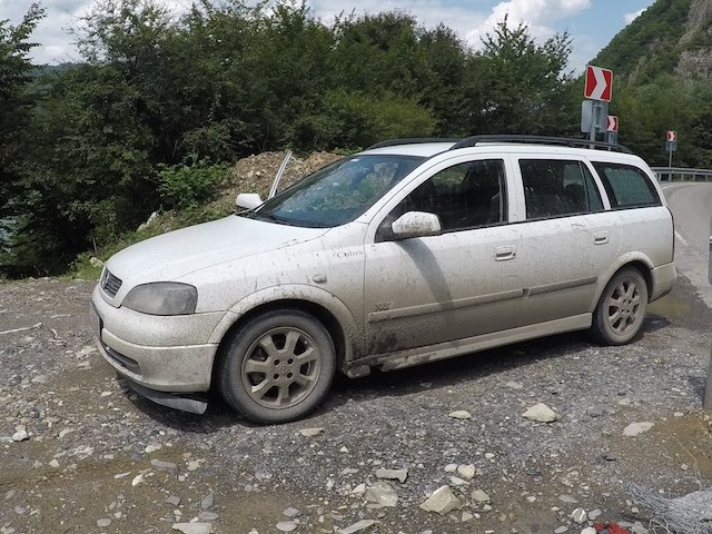 Our wrecked car with missing pieces after the treacherous journey in to Shatili