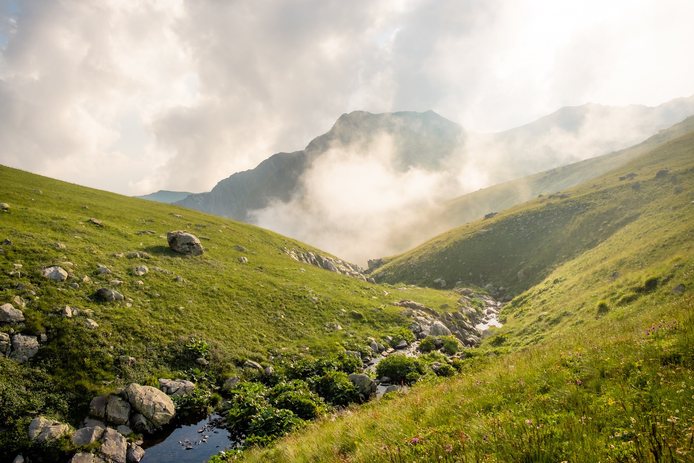 Sunset over a stream on mountain plateau in Lagodekhi Protected Areas, Georgia