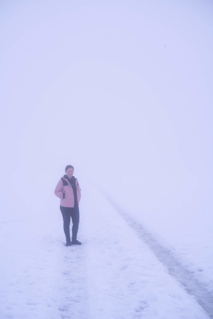 Caroline in thick fog and snow near Tatschnigteich lakes, Carinthia