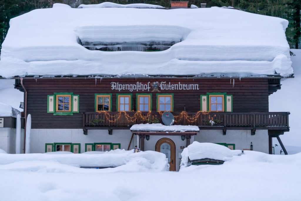 Gasthof Gutenbrunn covered in snow, Mallnitz, Carinthia