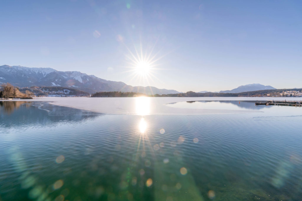 Half frozen Faakersee on a winters day, Villach, Carinthia