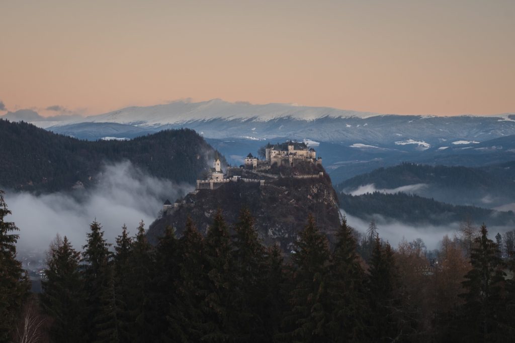 Hochosterwitz castle surrounded by fog at sunrise, Carinthia, Austria