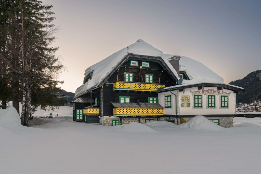 Traditional Austrian house, Hotel Harrida covered in snow, Weissensee, Carinthia