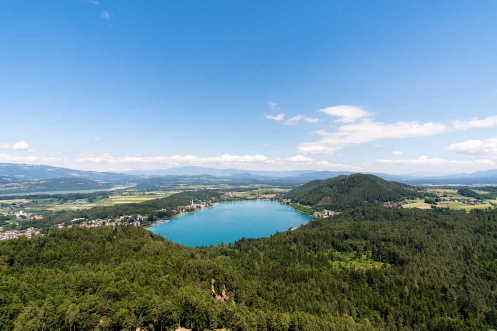 Klopeinersee lake during summer with turquoise water and blue skies , Carinthia