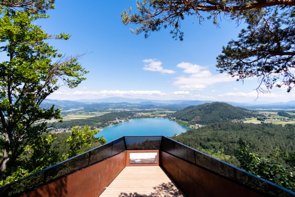 Klopeinersee lake viewing platform during summer with turquoise water and blue skies , Carinthia