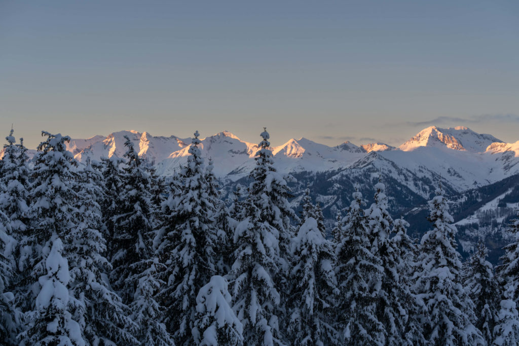 Snowy winter mountains and forest at sunset, Katschberg