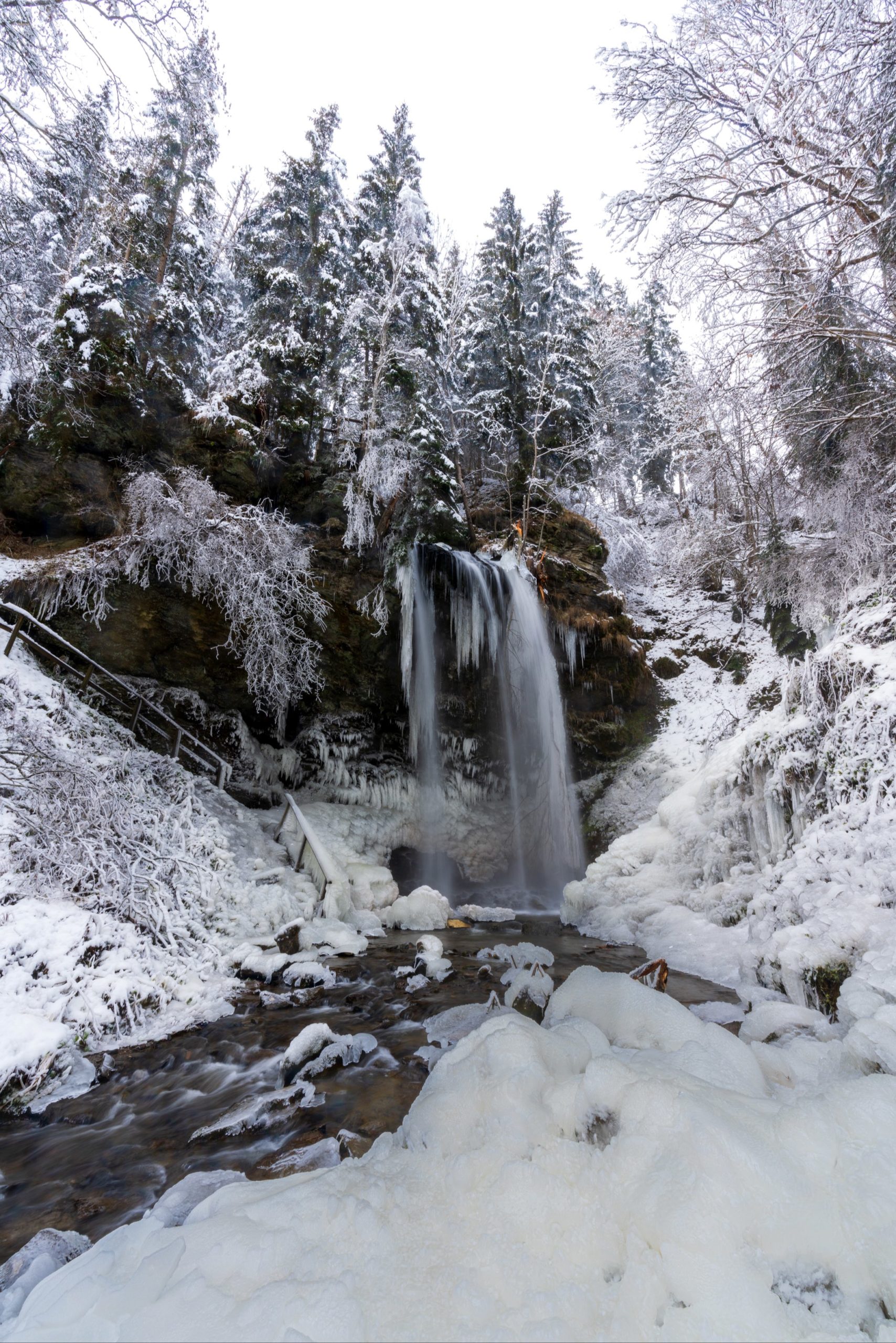 Sörger waterfall surrounded by snow and alien like ice structures in the middle of winter, Carinthia, Austria