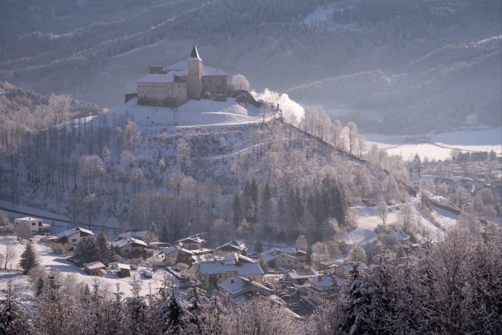 Strassburg castle on a snowy hill, frost covered winter morning, Gurk valley, Carinthia, Austria