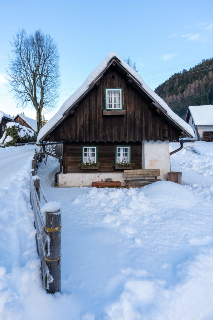 Traditional home surrounded by snow in Bodental, Carinthia