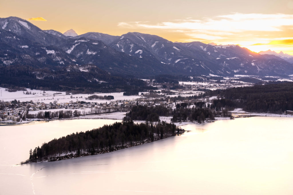 Winter sun setting at lake Faaker See, Villach, Carinthia