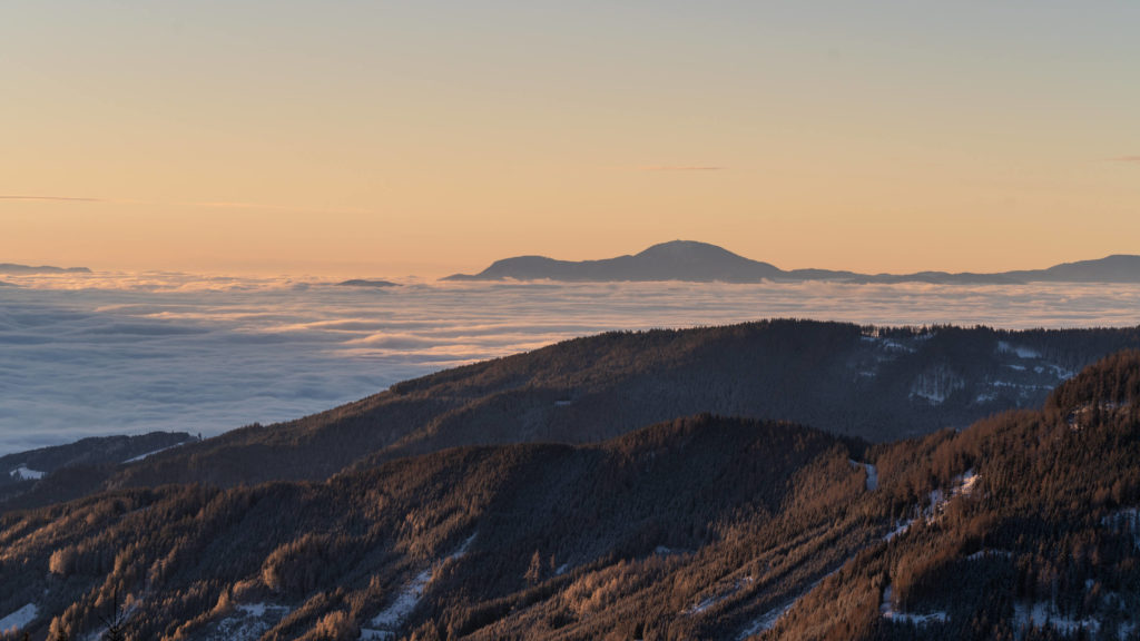 Winter sunrise and cloud inversion over Lavanttal from Klippitztörl, Carinthia