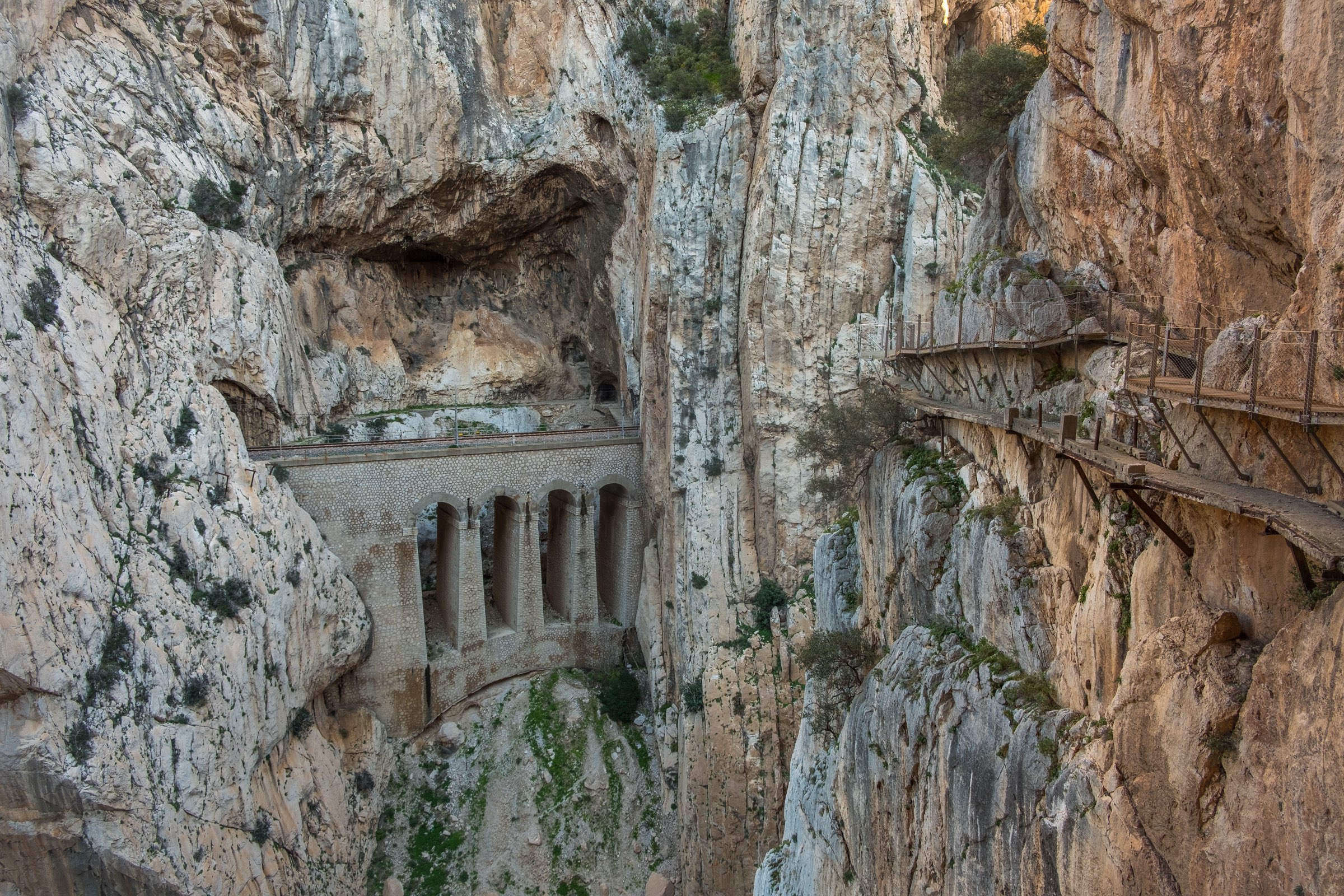 El Caminito del Rey pathway with train bridge