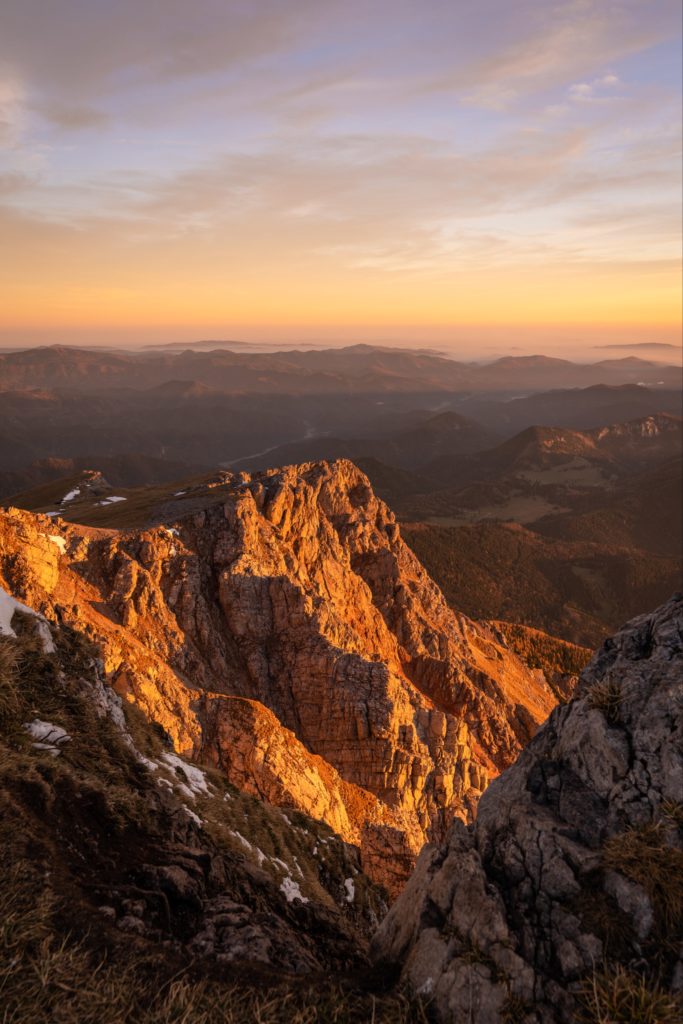 Illuminated cliffs of Schneeberg at sunrise