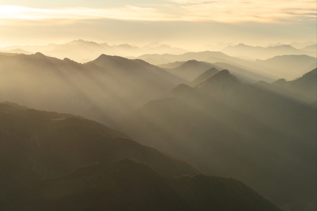 Layers of golden light over the many peaks from Schneeberg