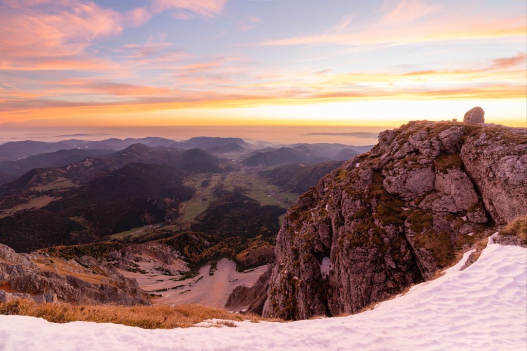 A magical sunrise from Lower Austria's highest peak with a cairn, Schneeberg