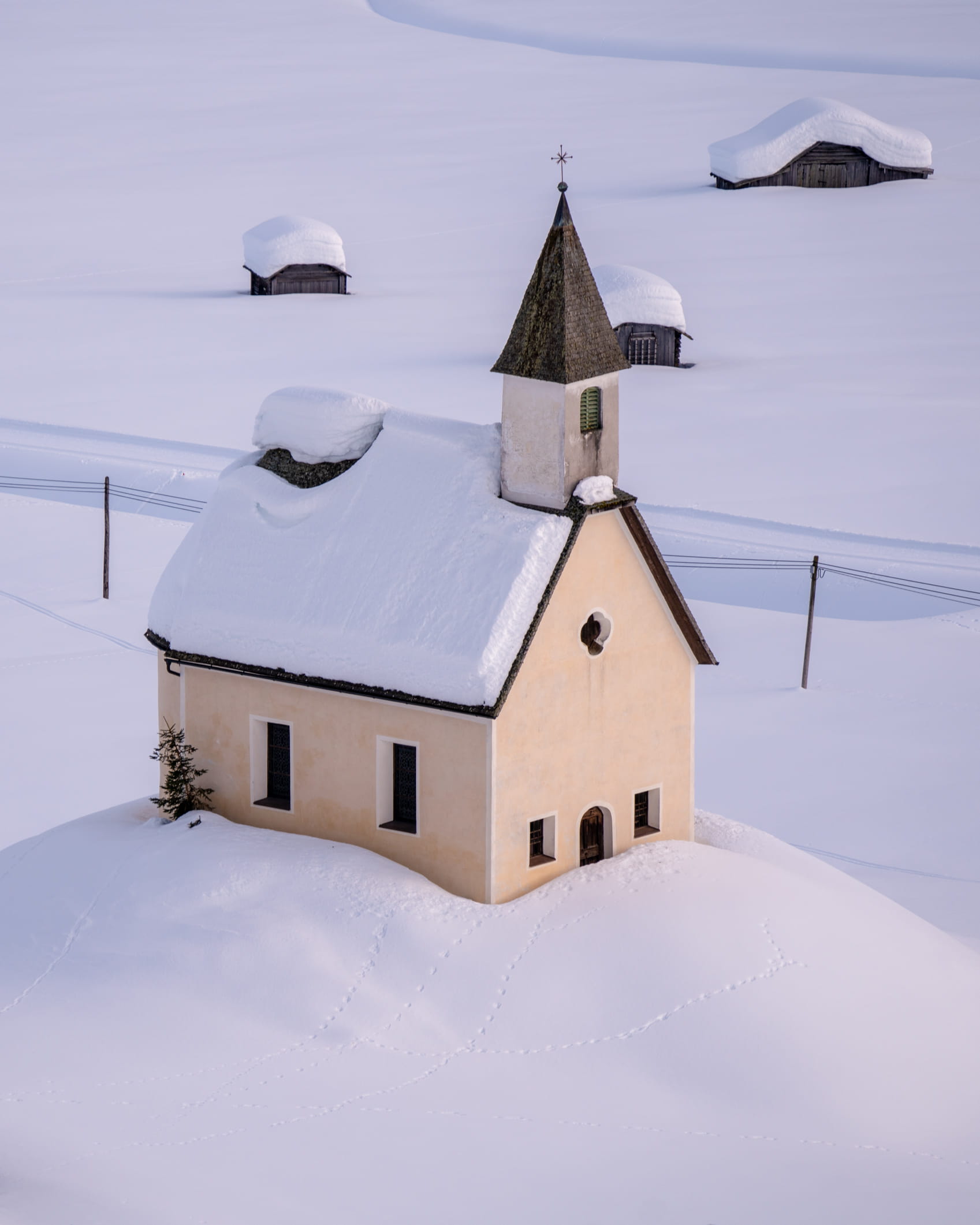 Tiny chapel of Obertilliach surrounded by thick snow, Lesachtal