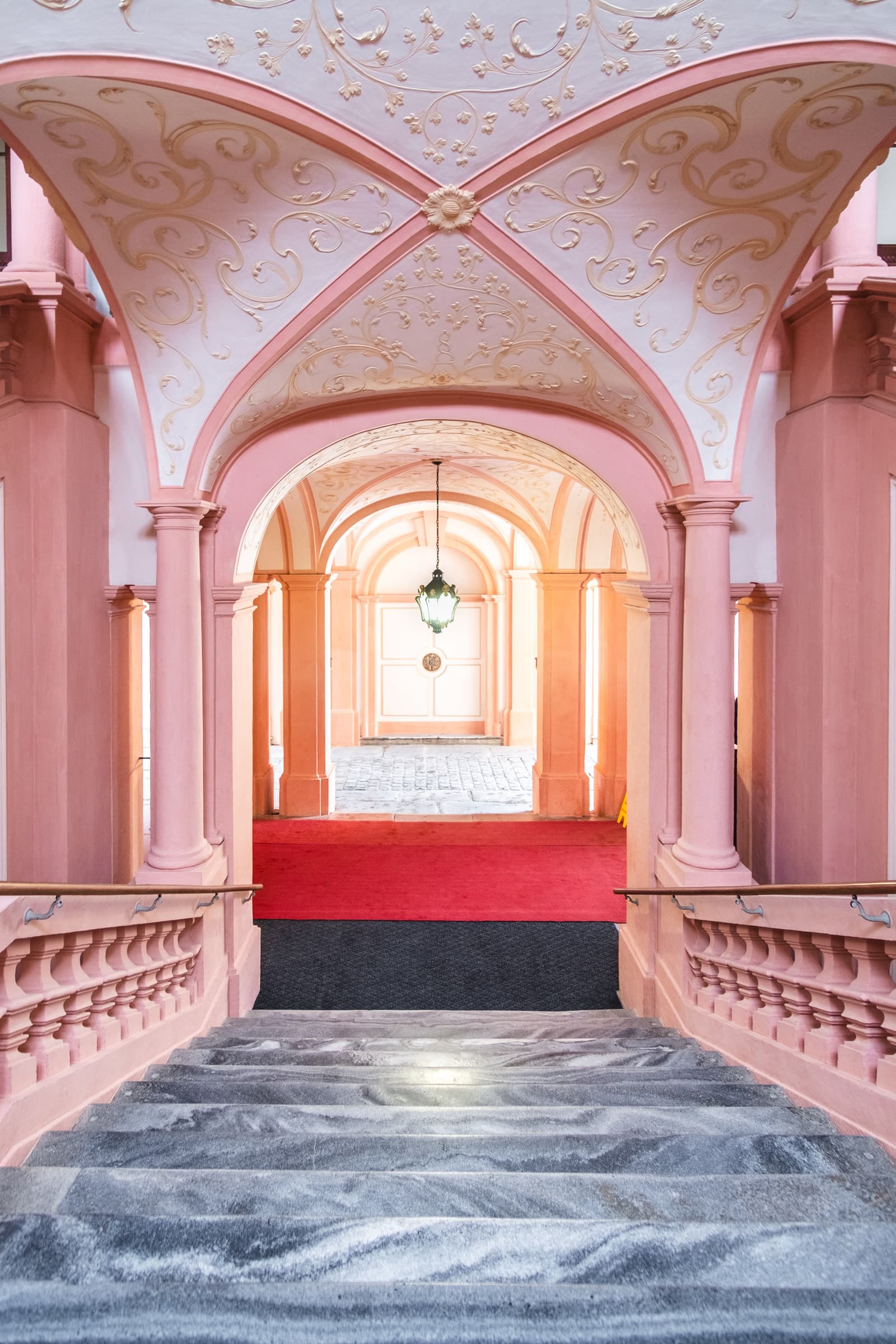 Pink staircase and passage inside Melk Abbey, Austria