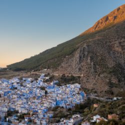 Sunset over Chefchaouen, Morocco from the Spanish Mosque with towering mountains behind