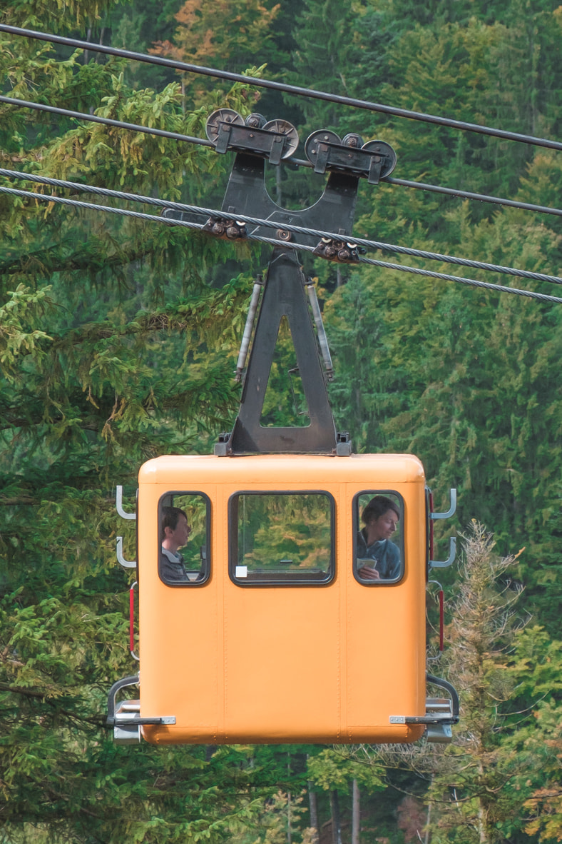 Zwölferhorn cute yellow cable cars near St. Gilgen