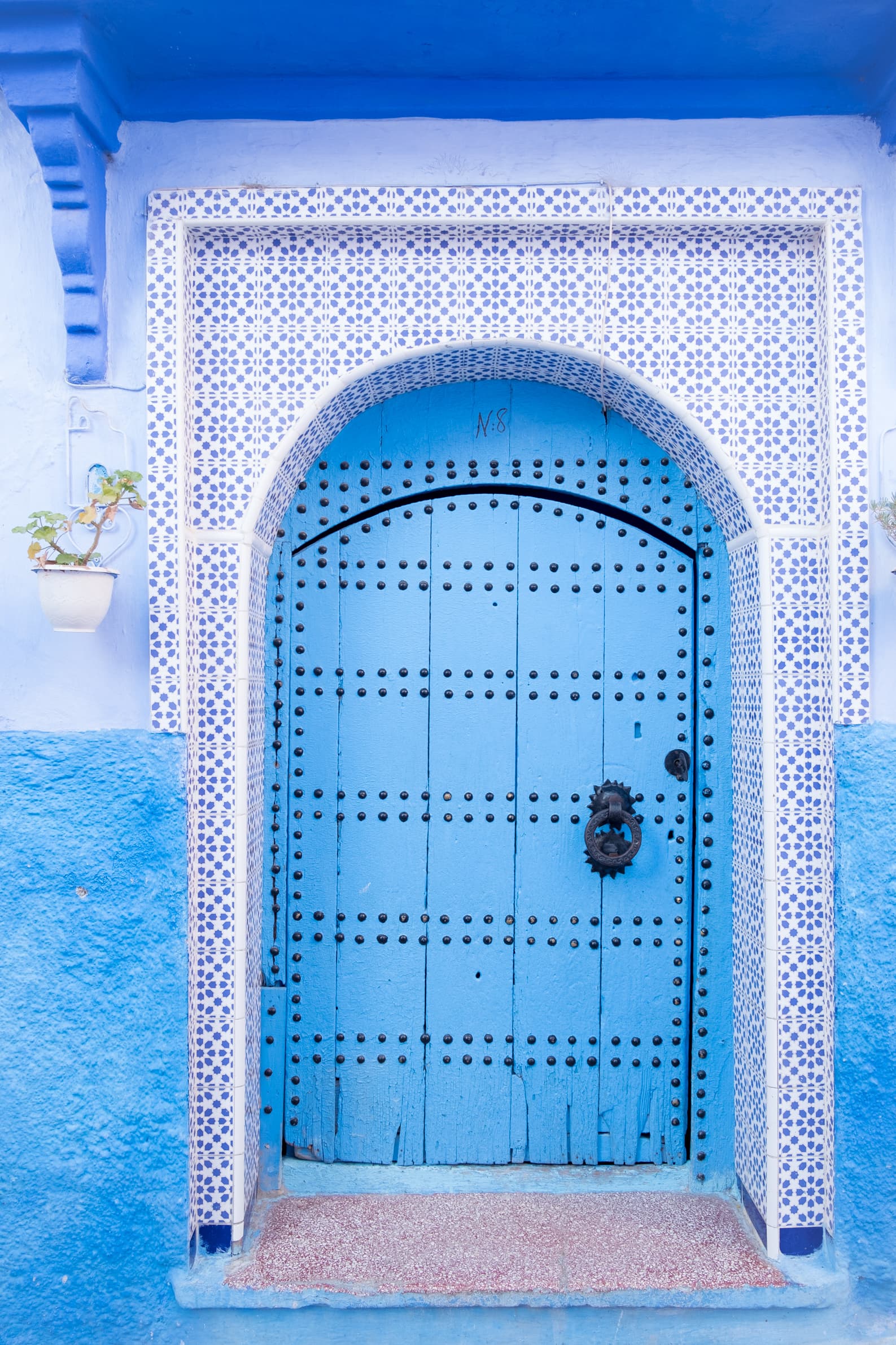 A gorgeous tiled blue door in Chefchaouen, Morocco