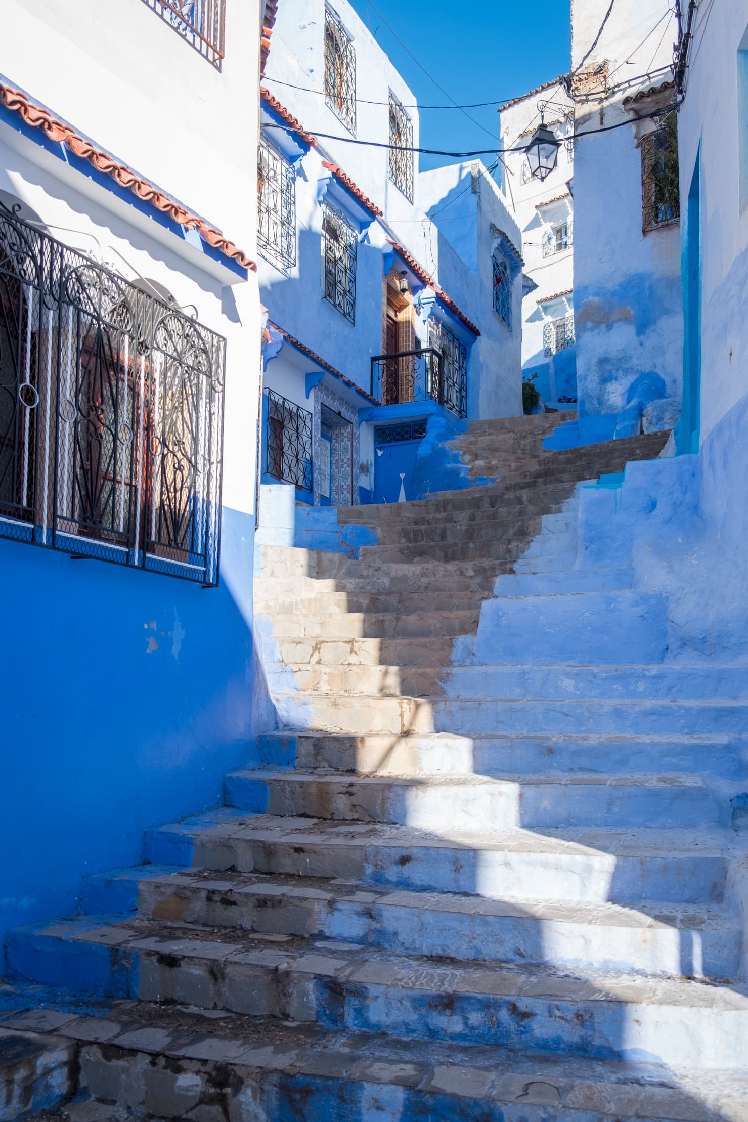 A steep staircase surrounded by blue houses, Chefchaouen, Morocco