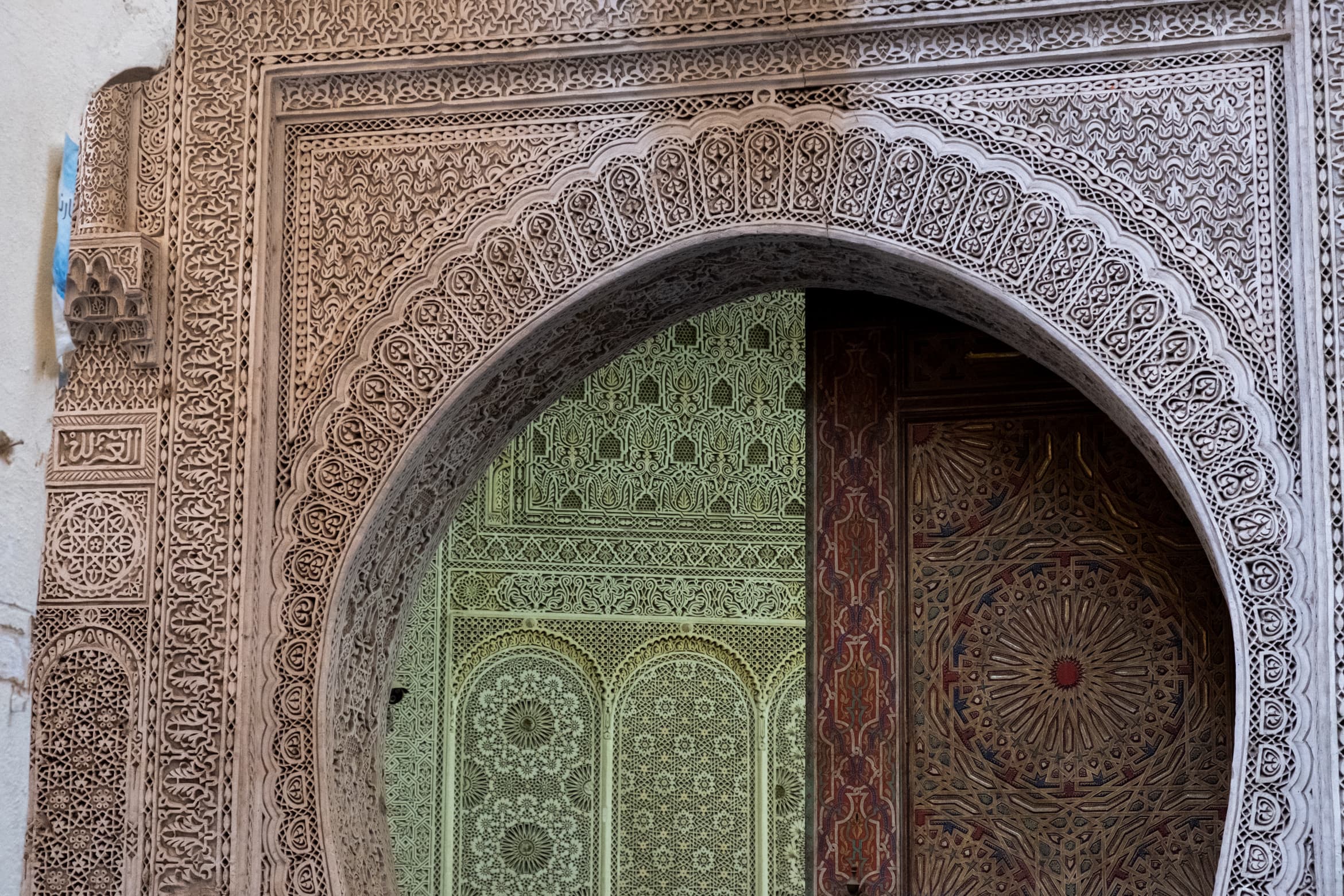 Intricately carved Islamic doorframe and interior in Fex