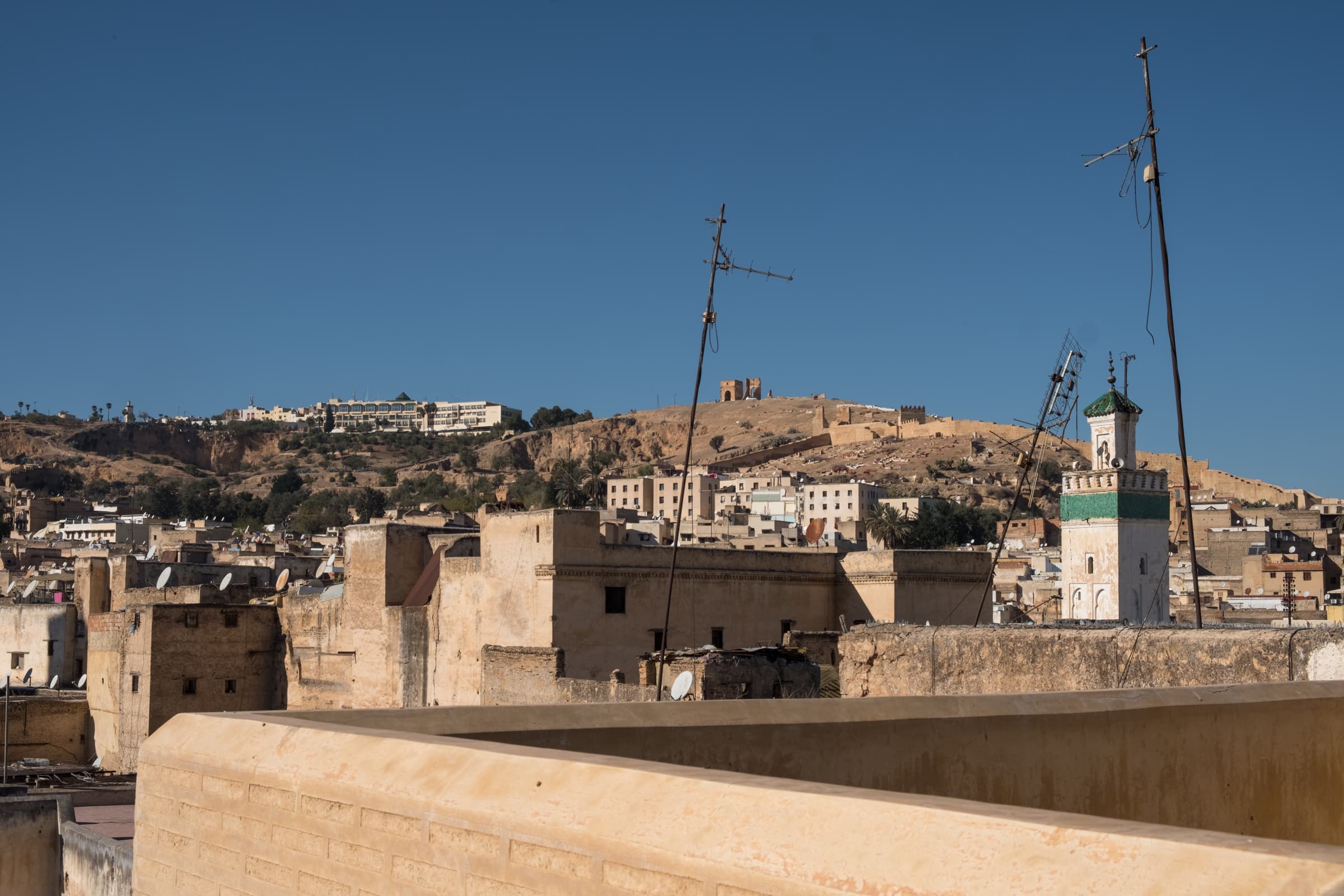 Minaret and old city walls from a rooftop in Fez, Morocco