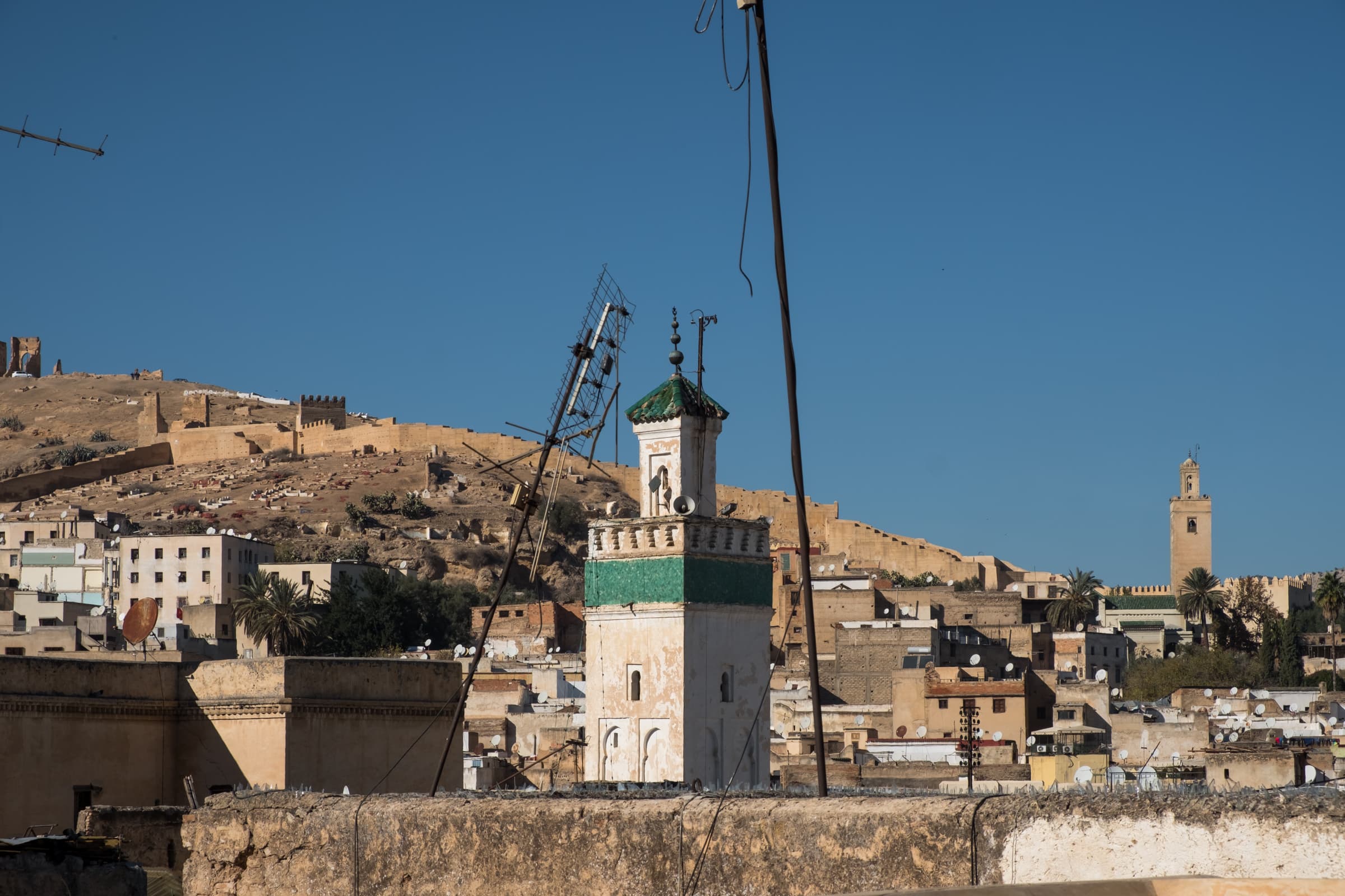 Minaret and old city walls from a rooftop in Fez, Morocco