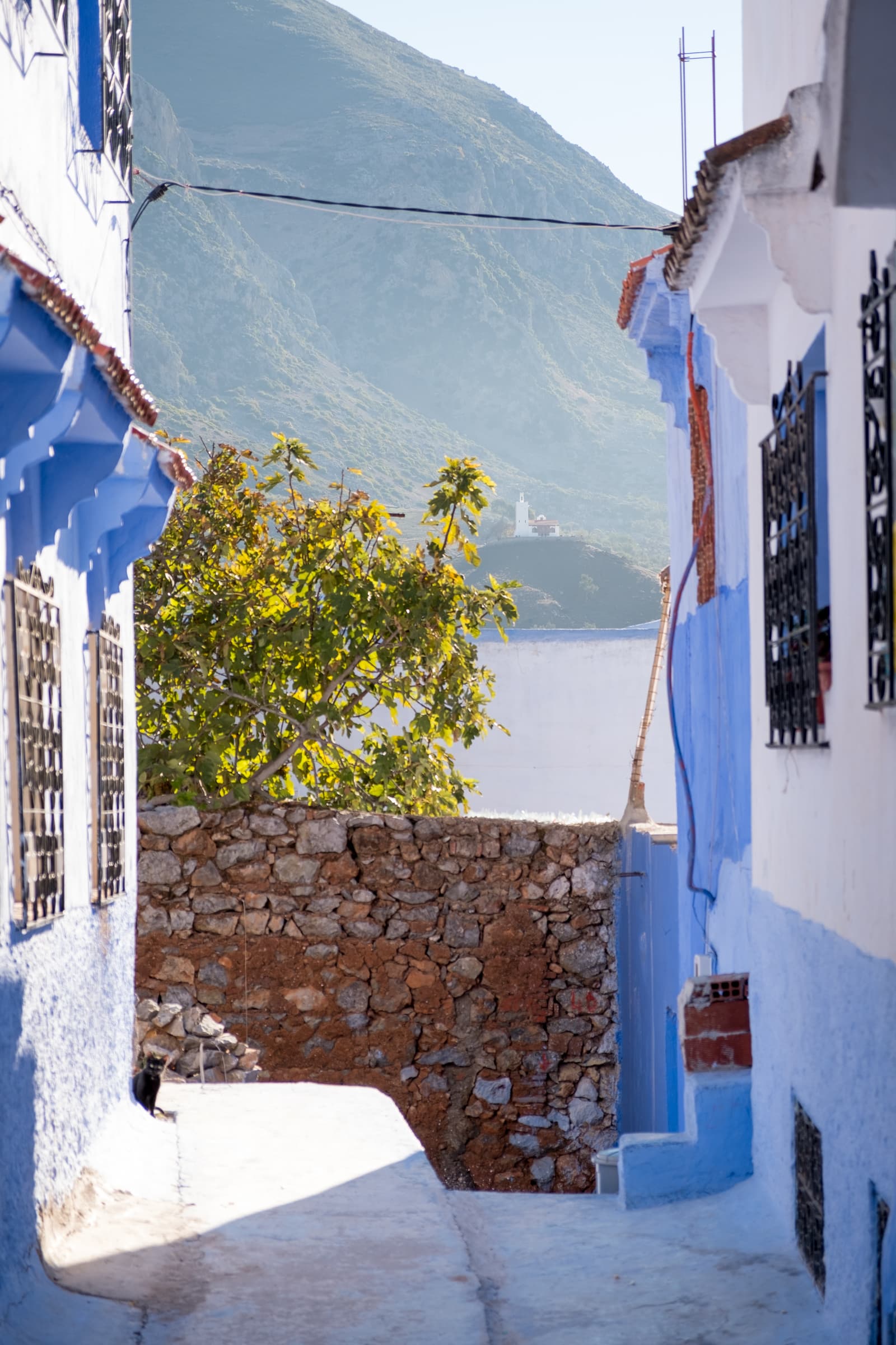 Looking over to the Spanish Mosque from a side street in Chefchaouen, Morocco