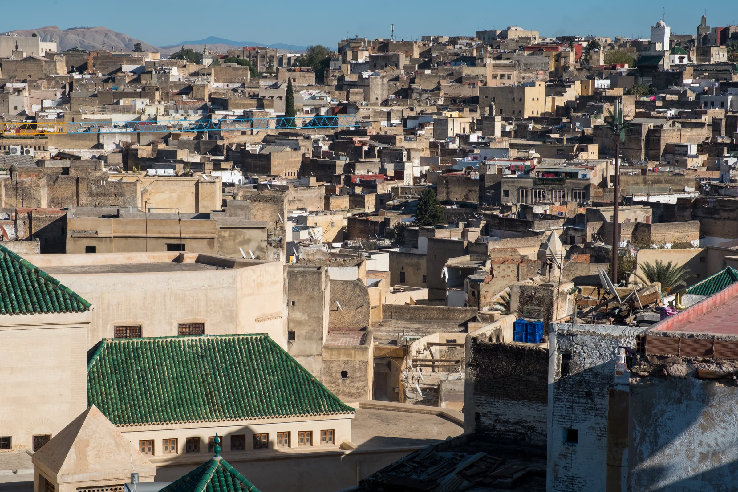 Buildings lining the hills of Fez from a rooftop