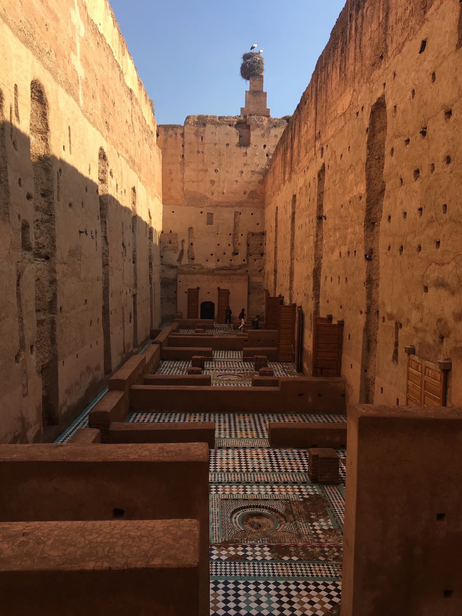 Interior of El Badi palace with intricate mosaic floors