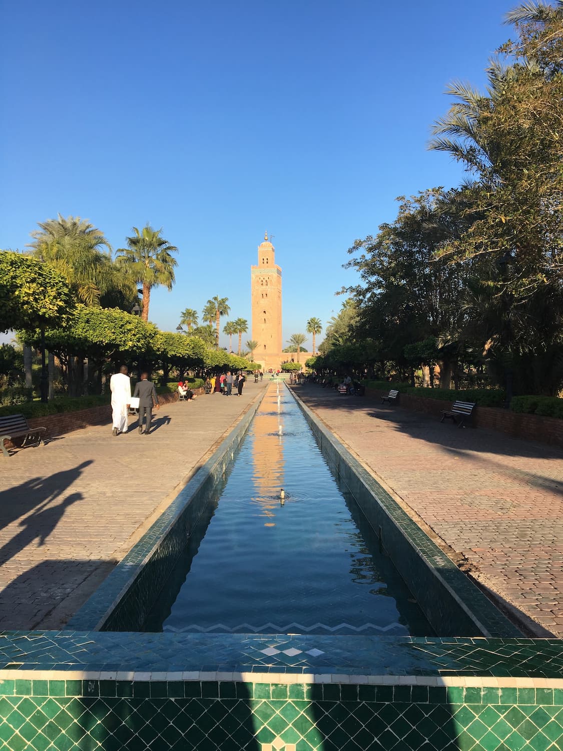 Water features leading to a minaret in Marrakesh