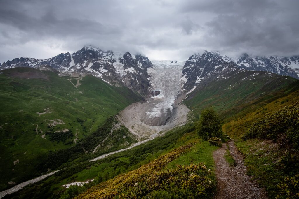 Adishi Glacier and the trail leading to the top of Chkhunderi pass, Svaneti, Georgia