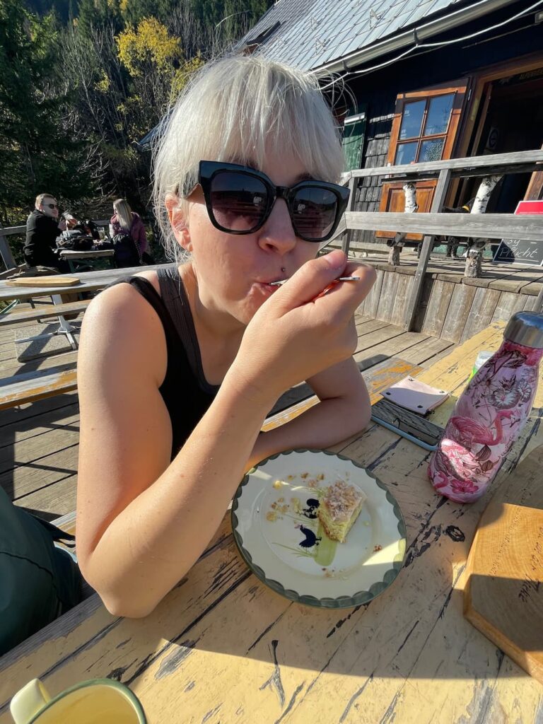 Caroline eating a cake at Edelweißhütte