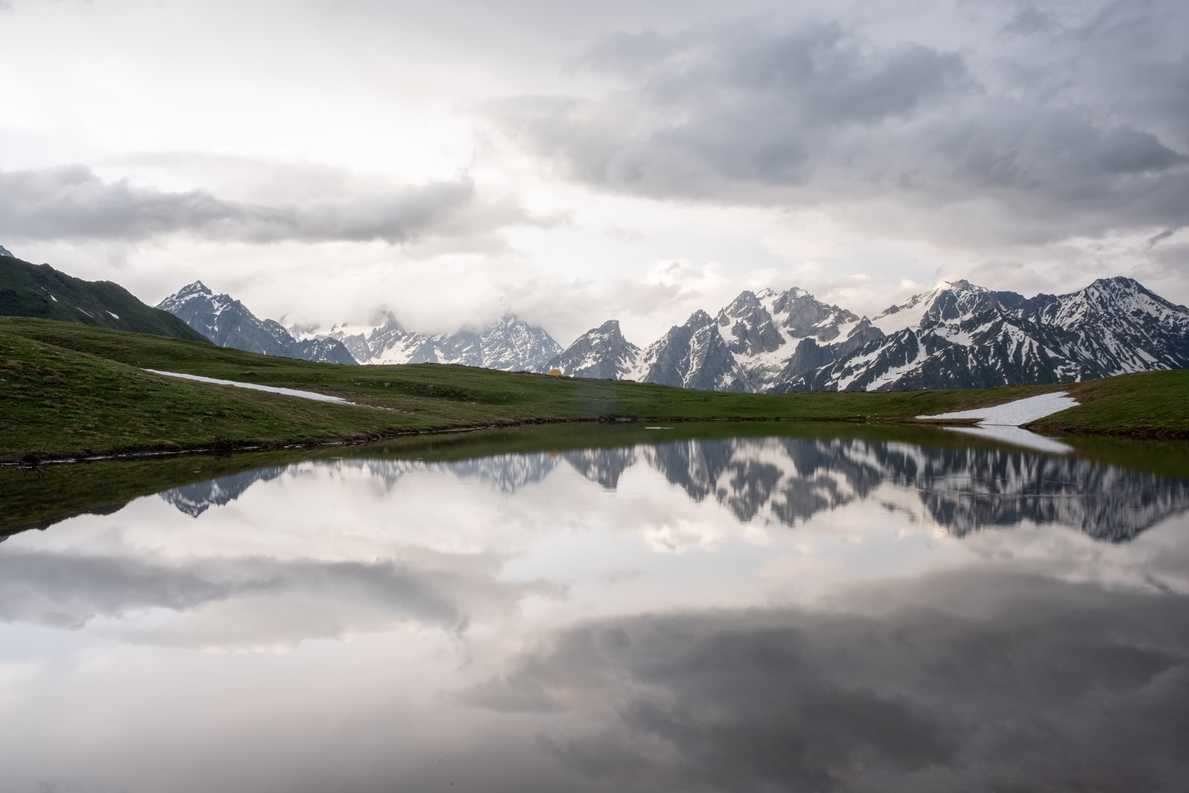 Light after the storm with still, calm and cloudy reflections at Koruldi lakes