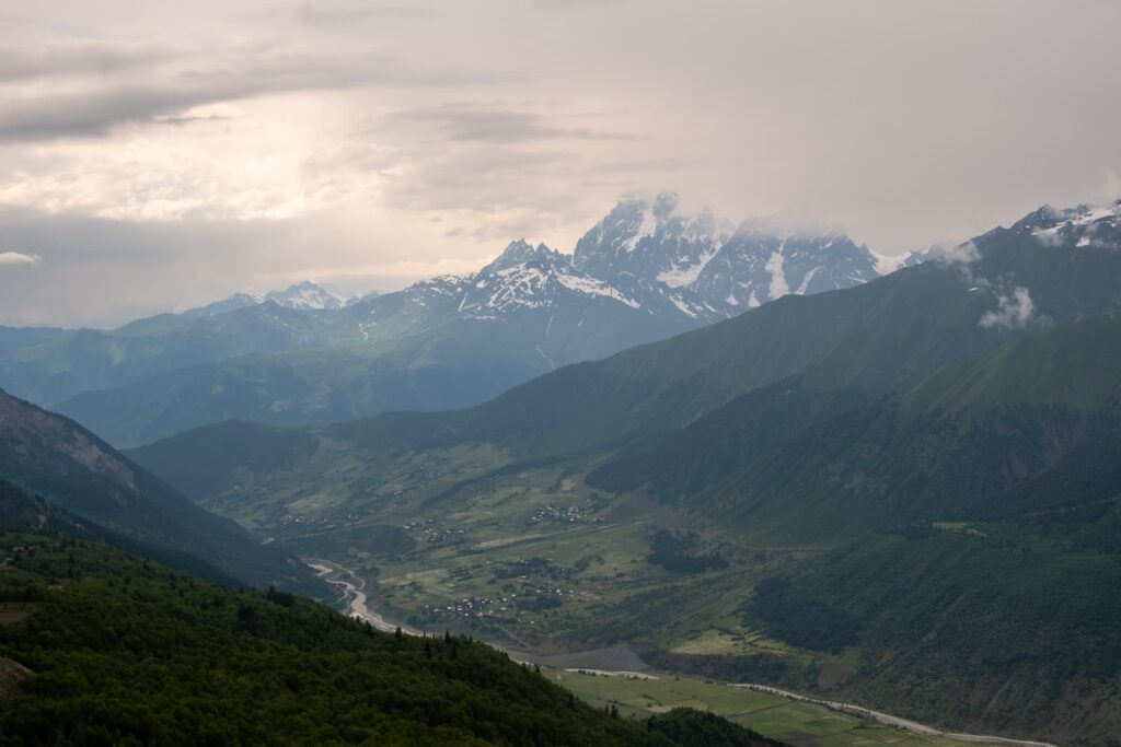 Mount Ushba and the surrounding villages on a moody day, Svaneti, Ushguli