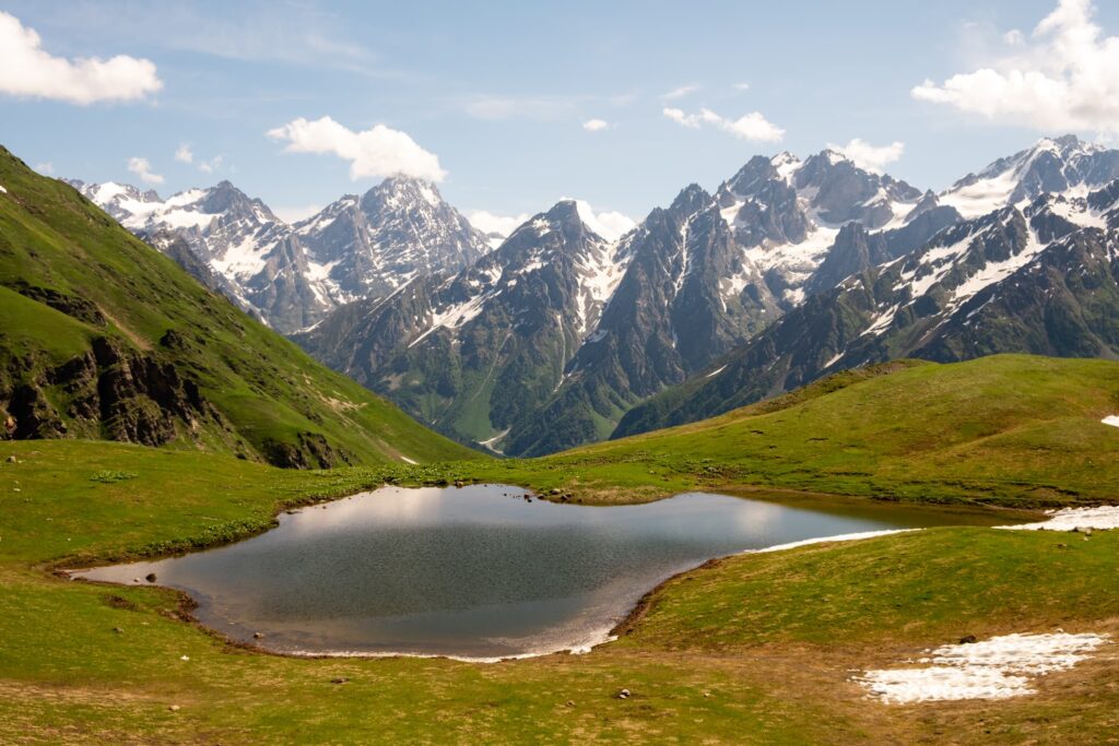 Sunny morning at Koruldi lakes with imposing mountains