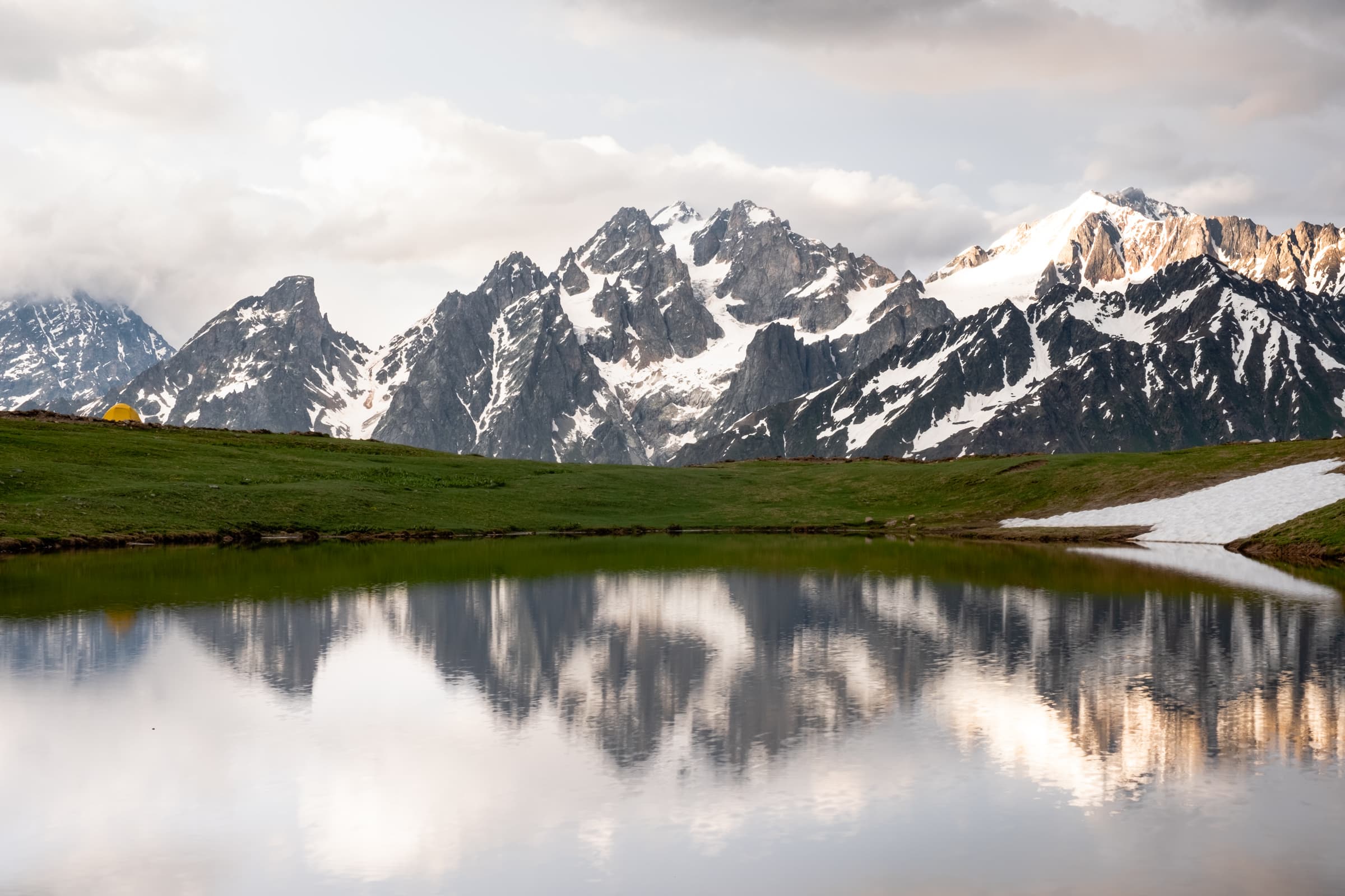 The clearing of the storm, beautiful soft light over the black snow capped jagged peaks