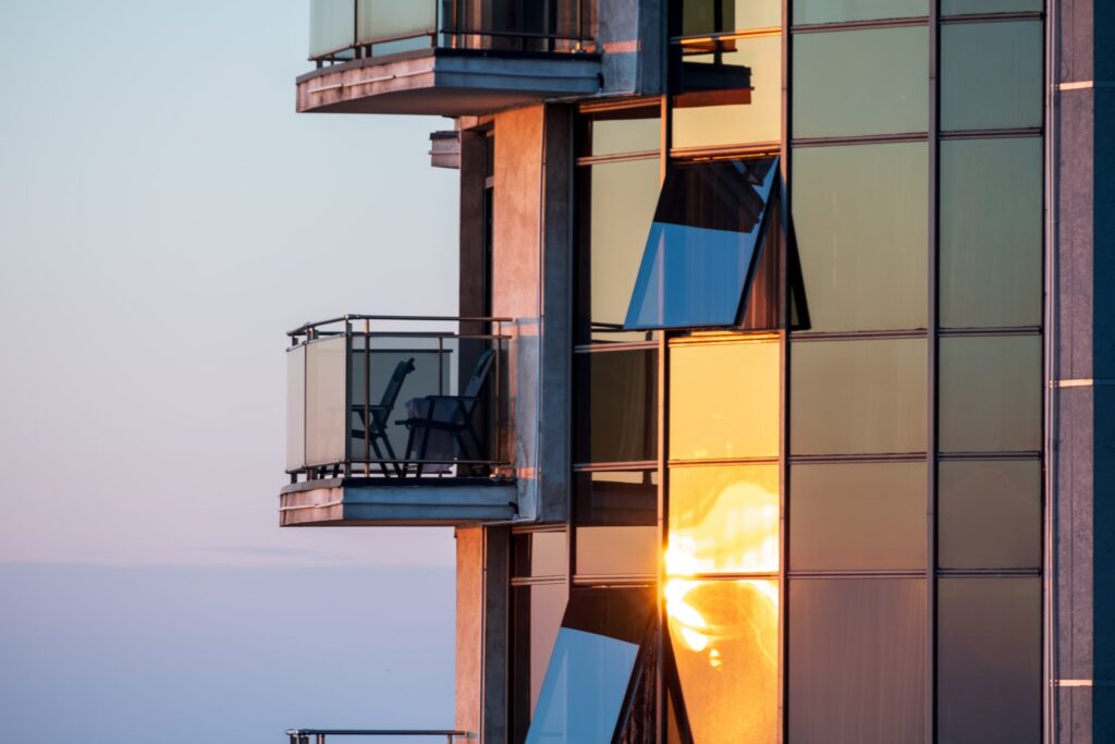Golden sun reflecting on a high rise apartment block in Batumi