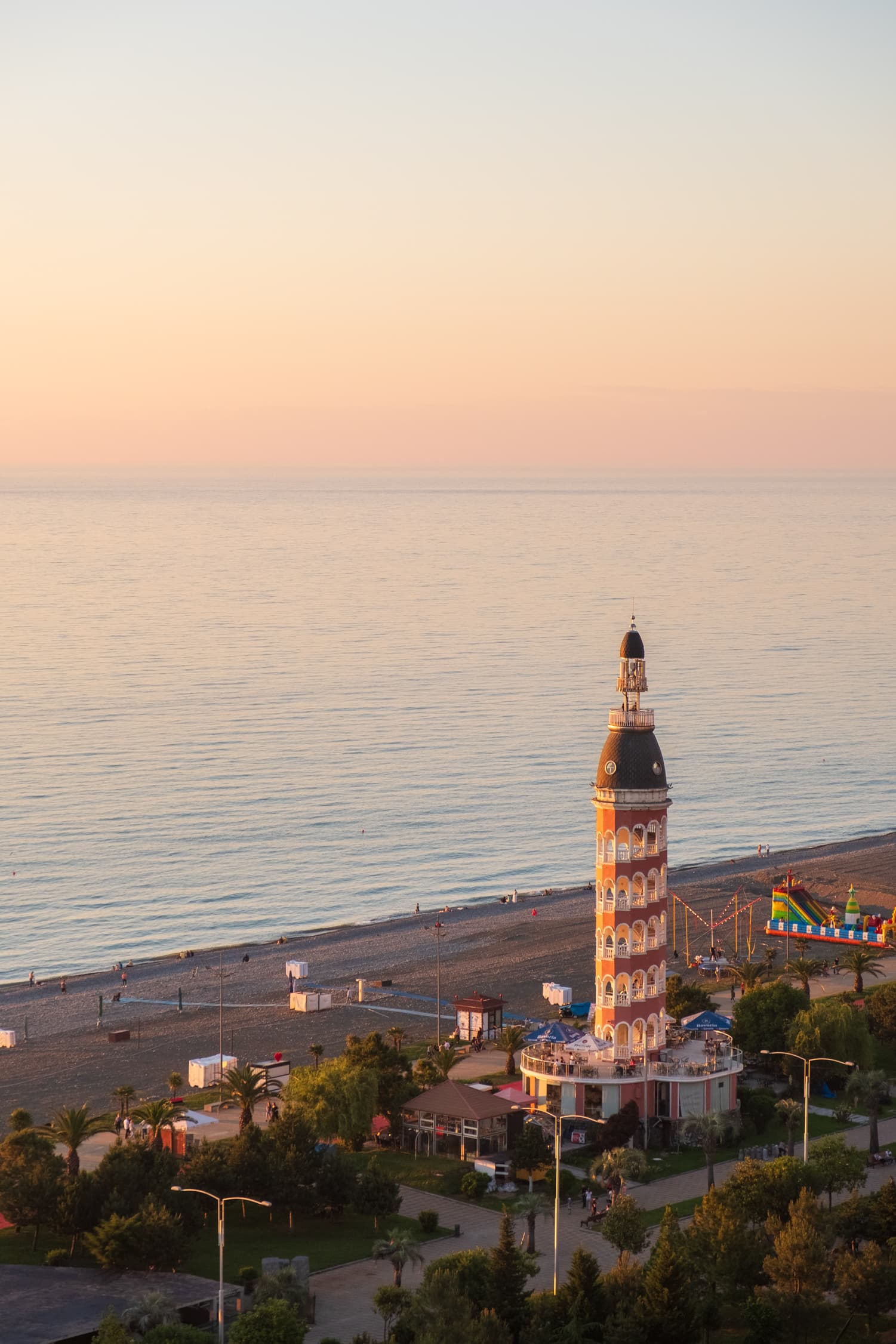 Golden sunset over the black sea with a glowing Tower of Love