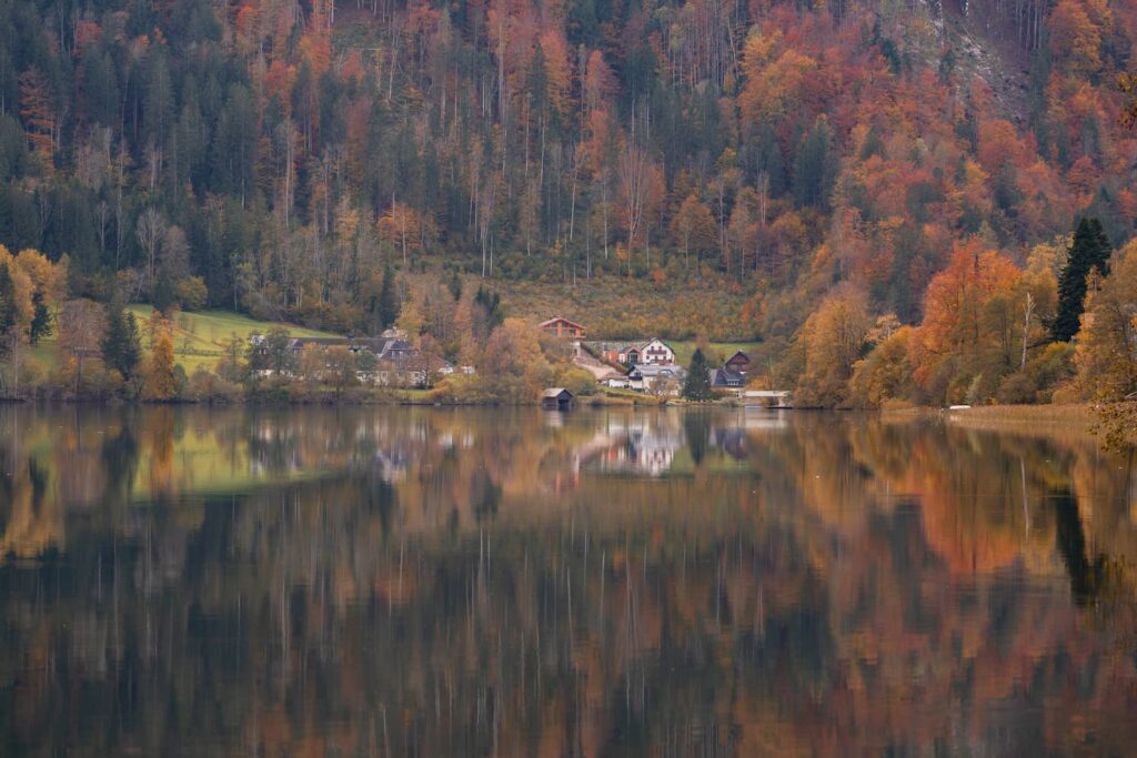 Old buildings and houses on the edge on lake Lunzersee during peak autumn